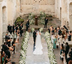 Bride walking down the aisle at wedding ceremony