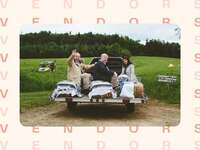 Guests sitting on back of truck at wedding