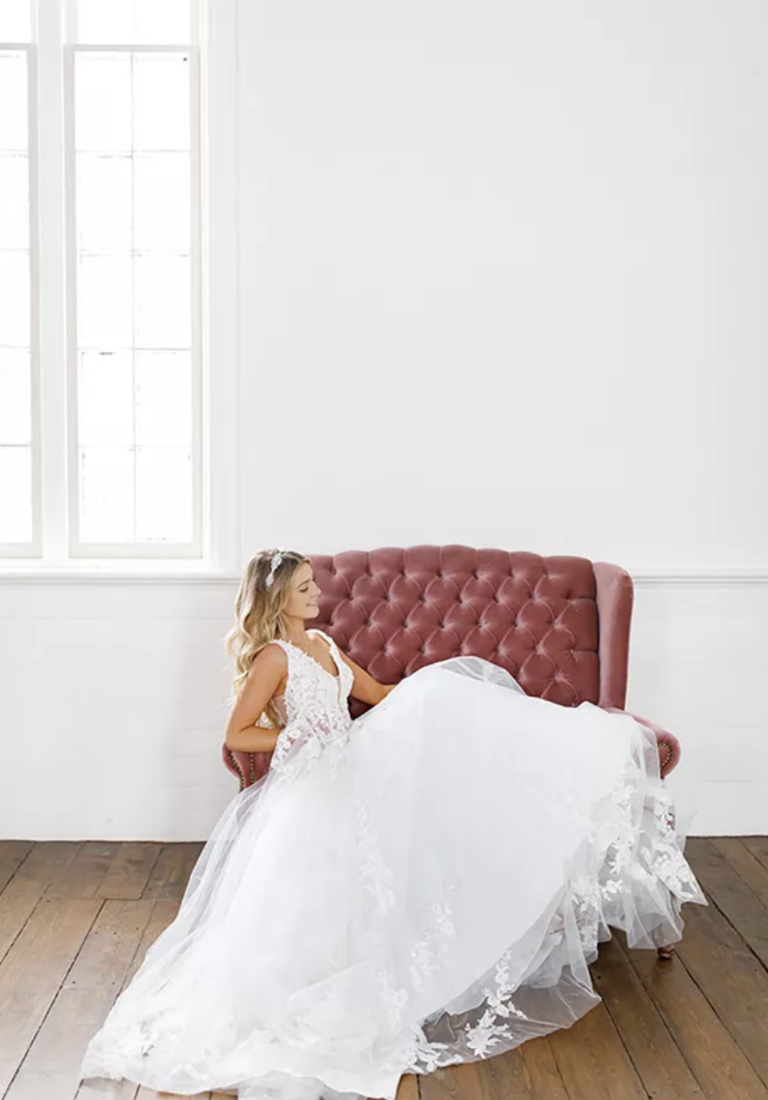 Ballgown with swirling lace patterns, plunging v-neck and sheer cutouts