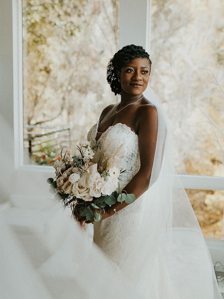 Side-swept updo with veil wedding hairstyle