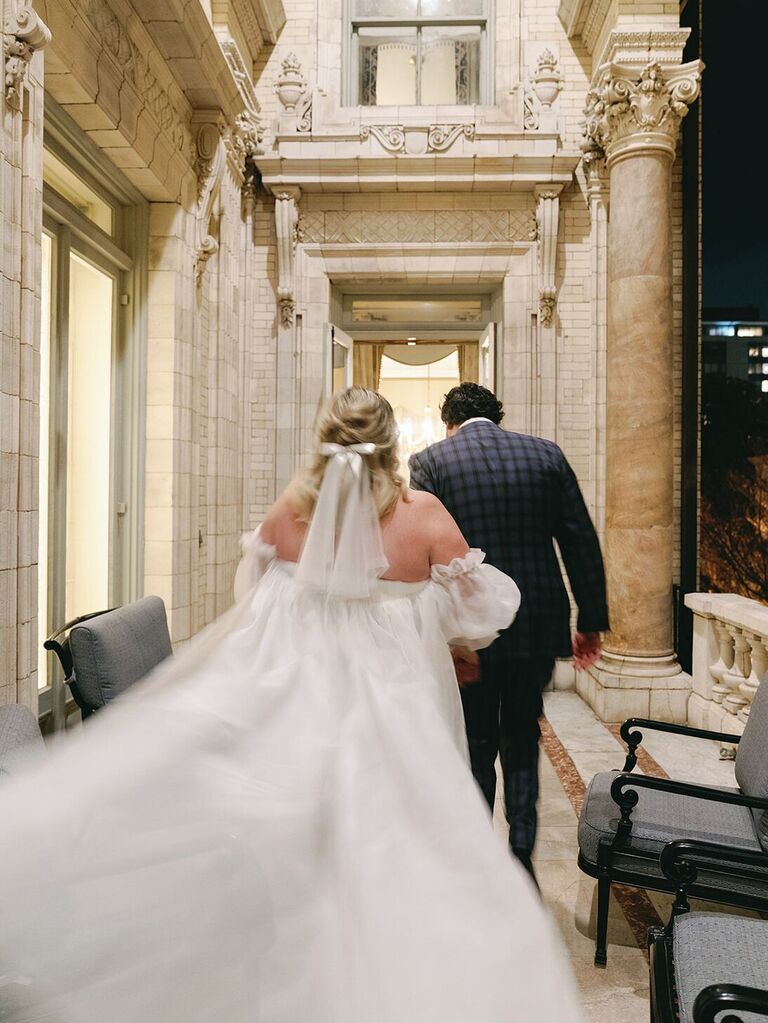 Bride walking while holding hands