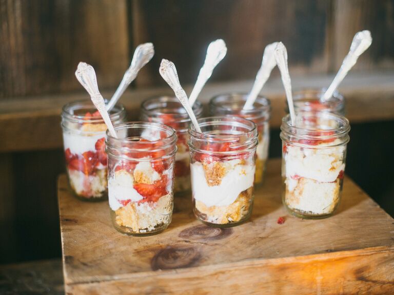 Delicious strawberry shortcakes presented in mason jars. 