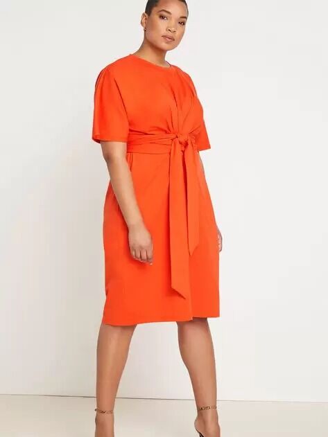 An orange short sleeve midi dress with a tie waist from ELOQUII