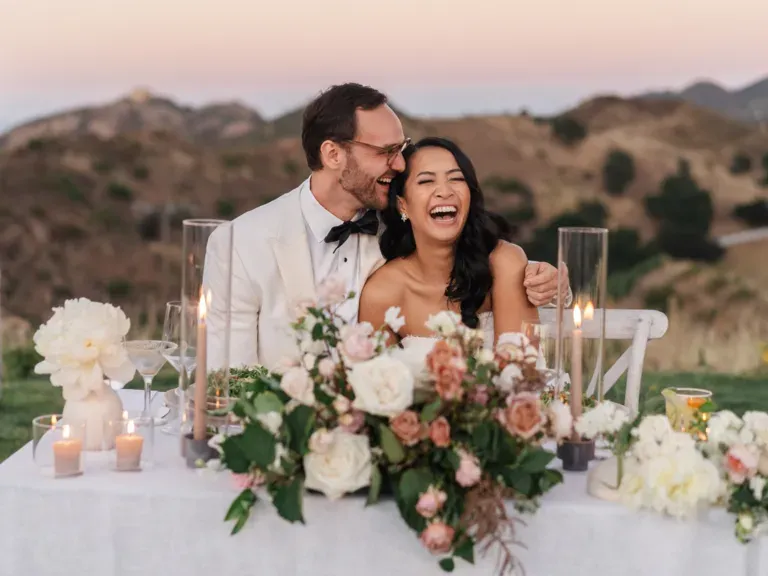Couple laughing on their wedding day