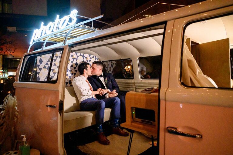 Couple kissing in vintage van photo booth
