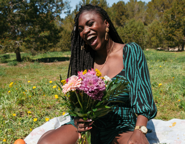 Woman holding a fresh bouquet of wild flowers