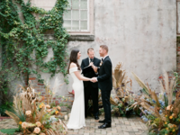 Vow exchange ceremony at bright DIY wedding