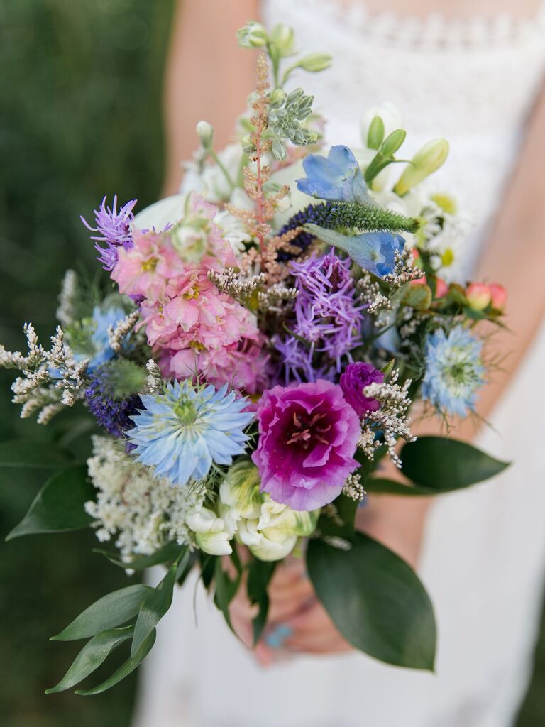 blue wedding bouquet with pink and purple flowers