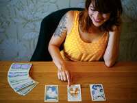 Tarot card reader with her deck of cards