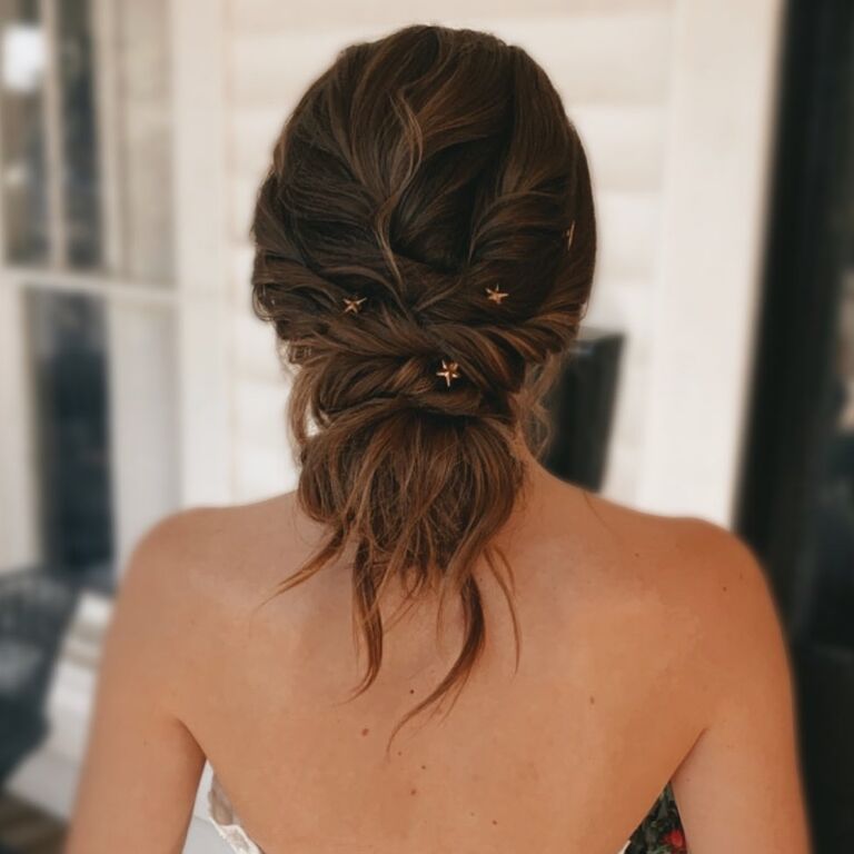 Tousled updo with star ornaments medium length wedding hairstyle