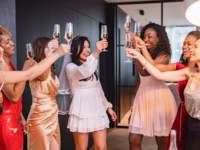 Bride and friends having celebratory toast at bridal shower