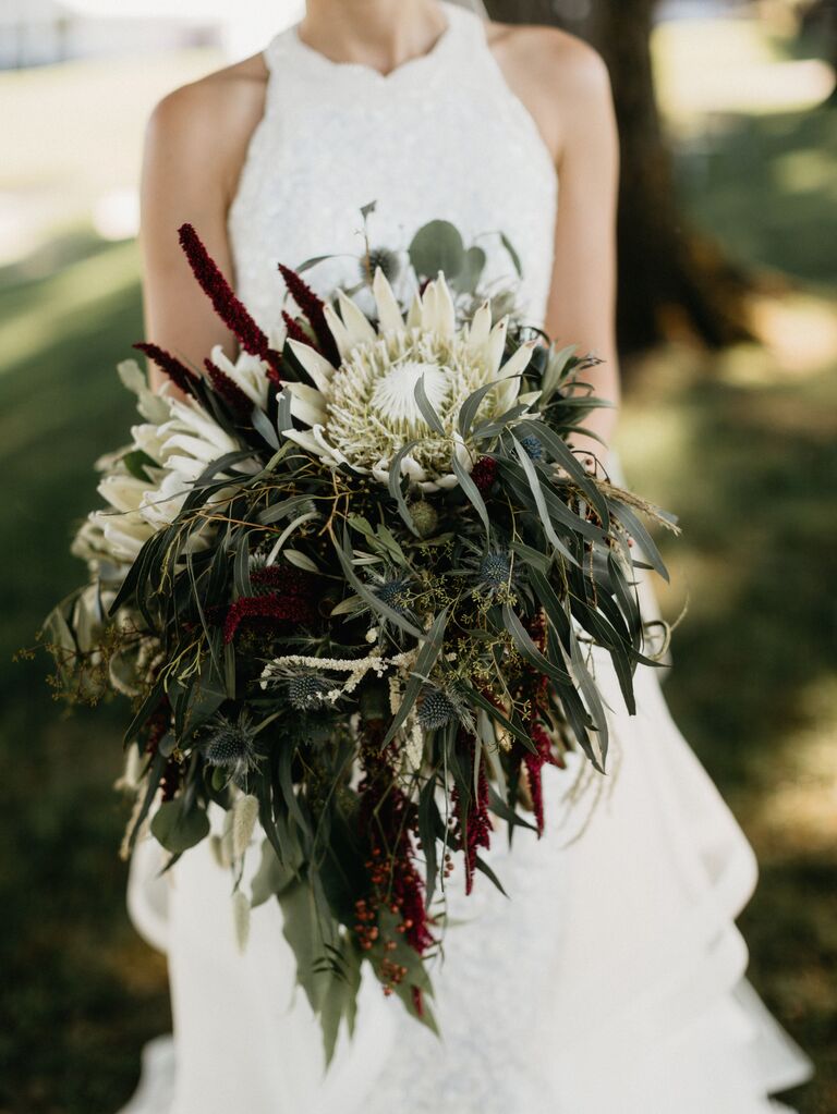 greenery bouquet for fall wedding with bay leaves, white protea, burgundy amaranthus and eucalyptus