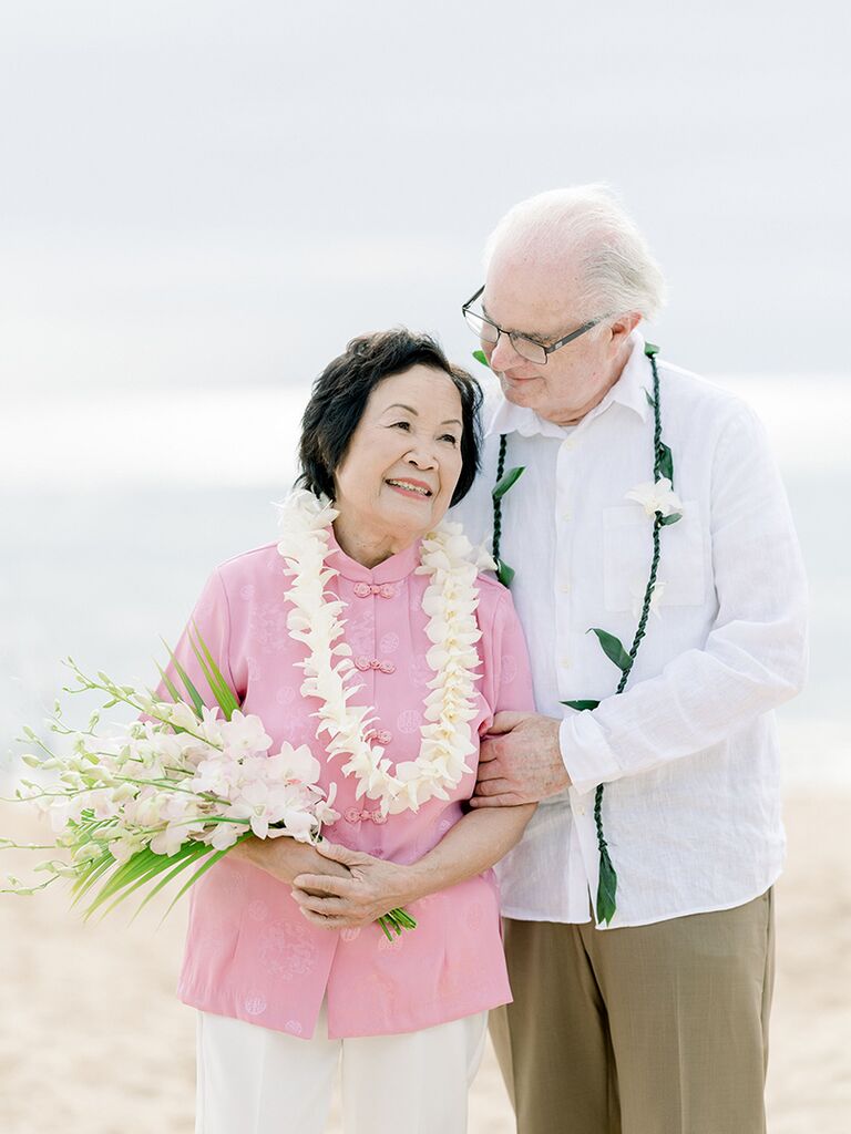 Elderly couple at vow renewal on the beach