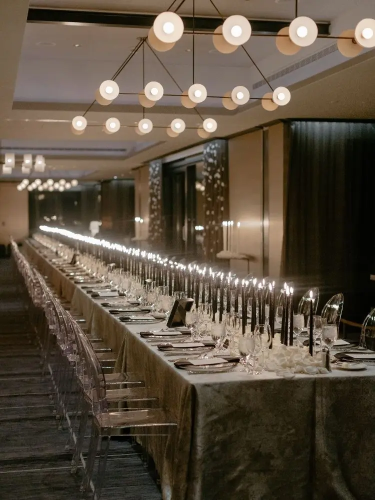 Reception table with black taper candles