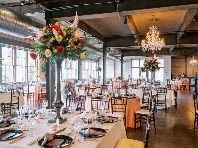Inside industrial reception space with a hanging crystal chandelier
