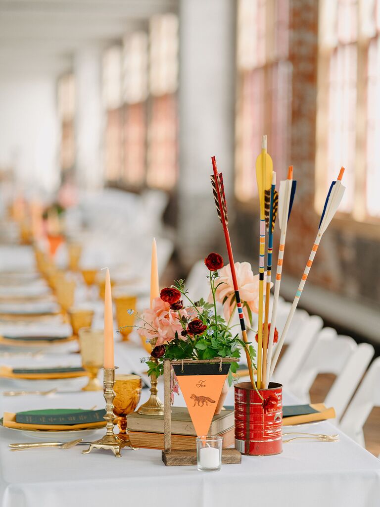 Arrow decoration at camp-themed wedding