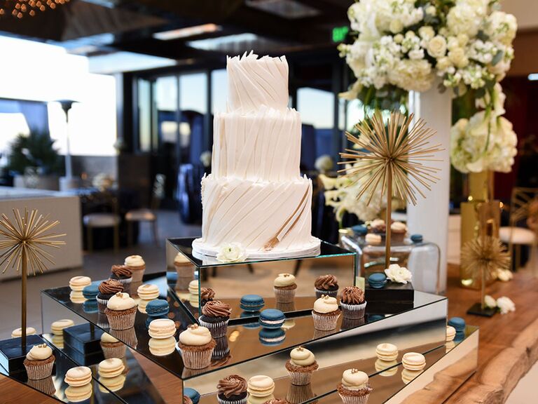 modern mirrored table with macarons for wedding dessert bar