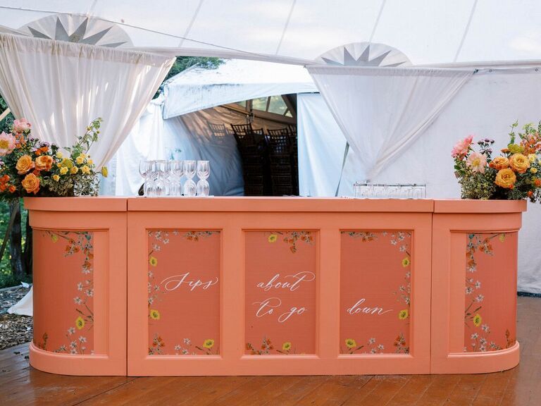 Handpainted floral wedding bar at reception